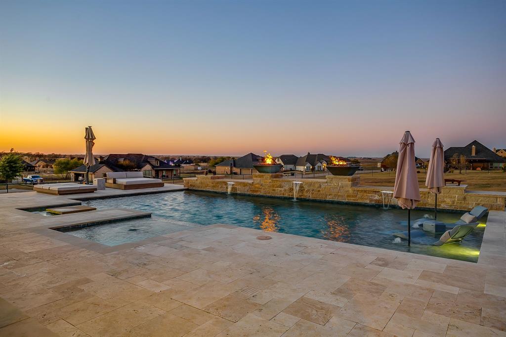 7320 Spring Ranch Court Godley, TX 76044 - Photo 13 of 40 a view of a lake with boats and trees in the background