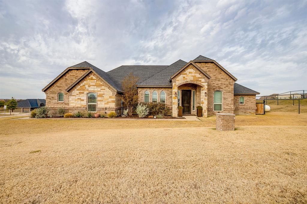 7320 Spring Ranch Court Godley, TX 76044 - Photo 16 of 40 a view of big room with wooden floor and windows