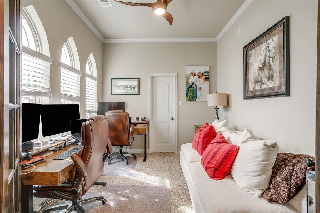 7320 Spring Ranch Court Godley, TX 76044 - Photo 27 of 40 a bedroom with a bed and a furniture