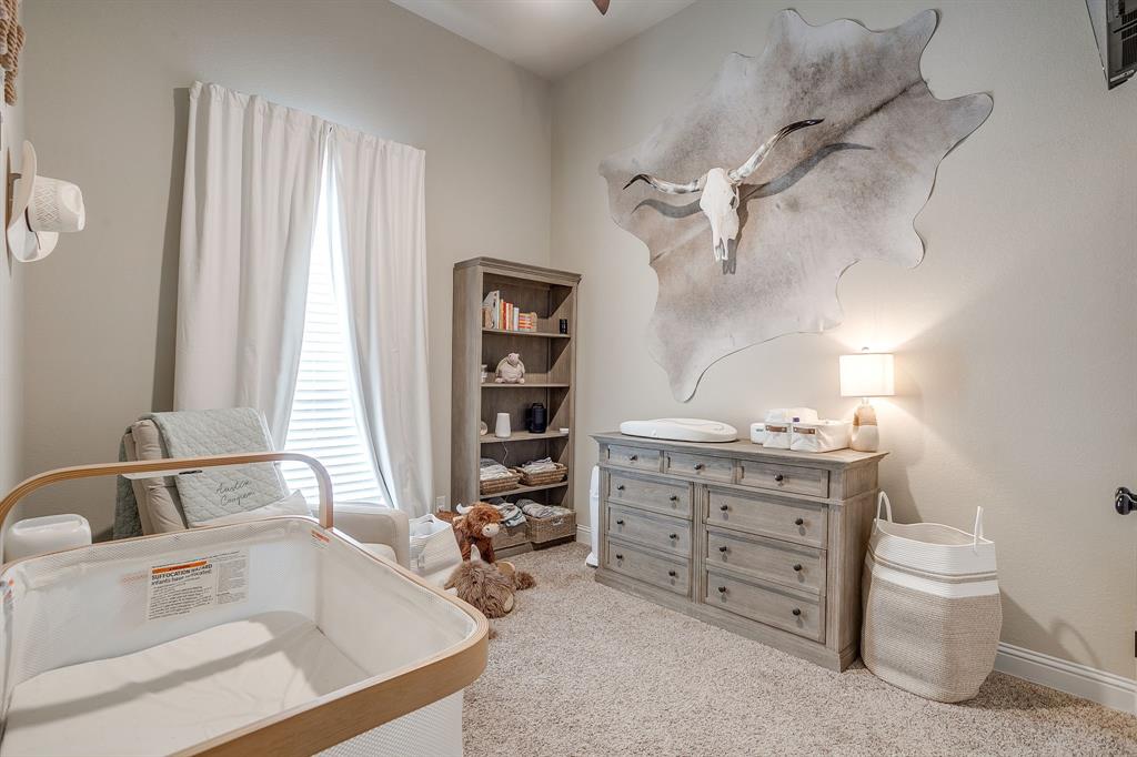 7320 Spring Ranch Court Godley, TX 76044 - Photo 33 of 40 a bathroom with a tub sink and a large mirror