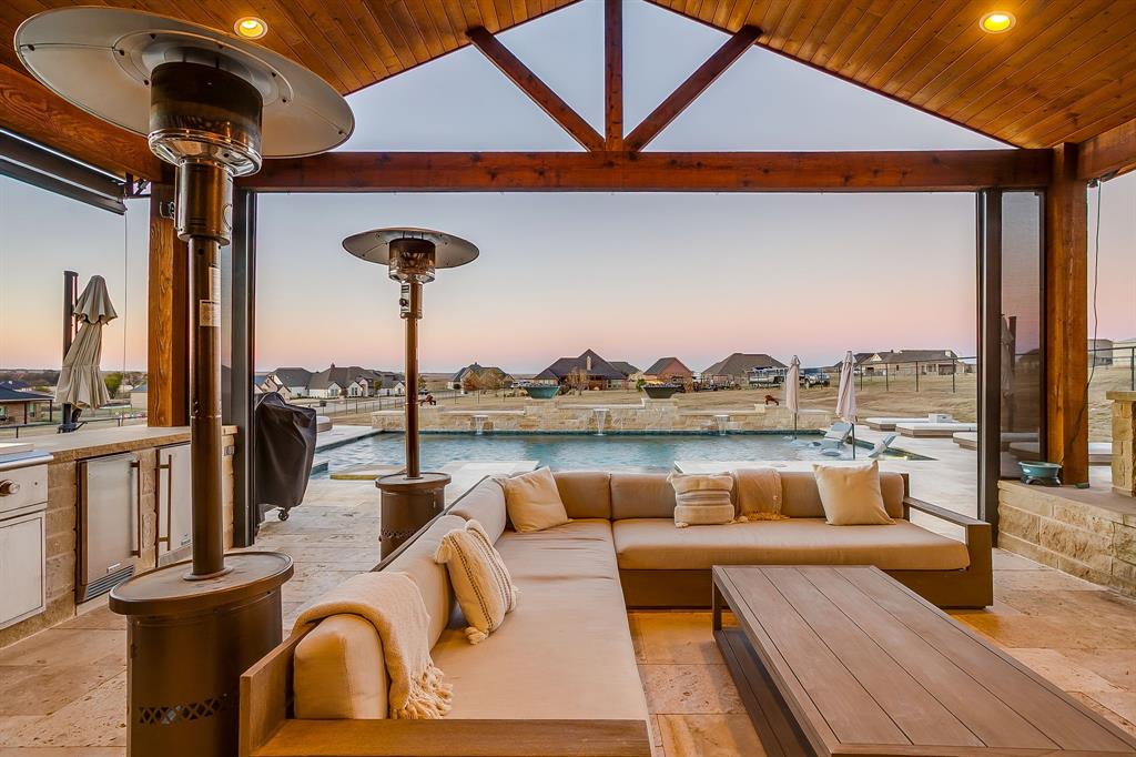 7320 Spring Ranch Court Godley, TX 76044 - Photo 4 of 40 a outdoor living space with patio furniture and a fireplace