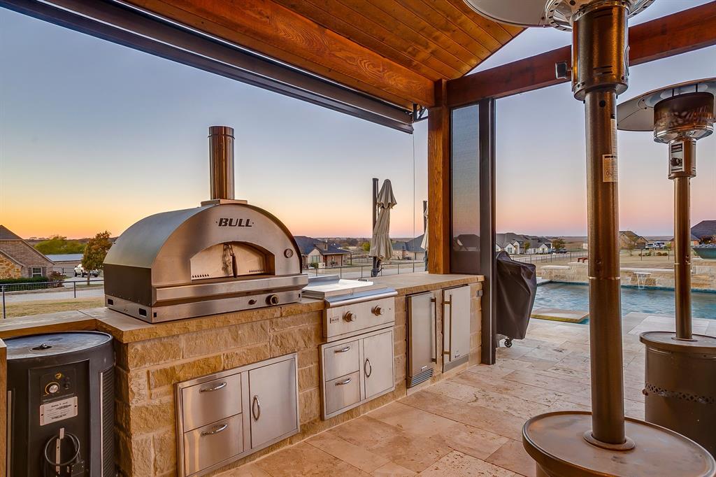 7320 Spring Ranch Court Godley, TX 76044 - Photo 6 of 40 a kitchen with a stove and a sink