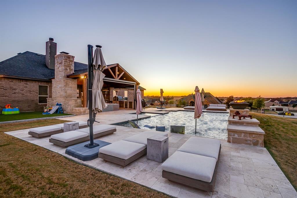 7320 Spring Ranch Court Godley, TX 76044 - Photo 8 of 40 a front view of a house with garden and trees