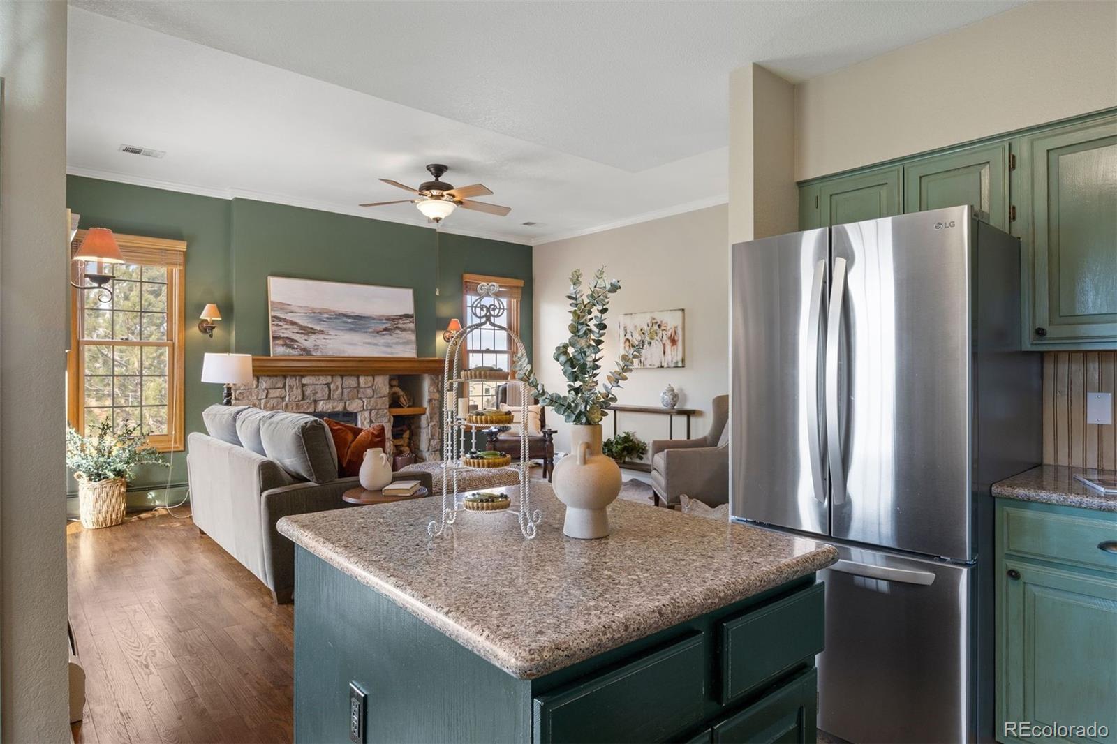 10 Roder Gate Lane Castle Pines, CO 80108 - Photo 13 of 32 a kitchen with a refrigerator and countertop