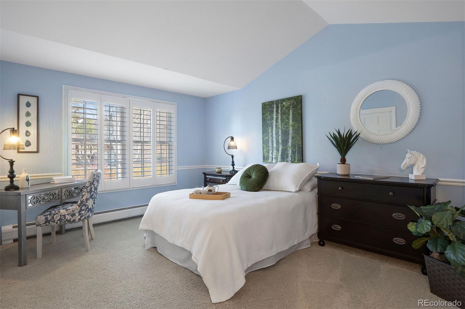 10 Roder Gate Lane Castle Pines, CO 80108 - Photo 16 of 32 a bedroom with a bed and a dresser