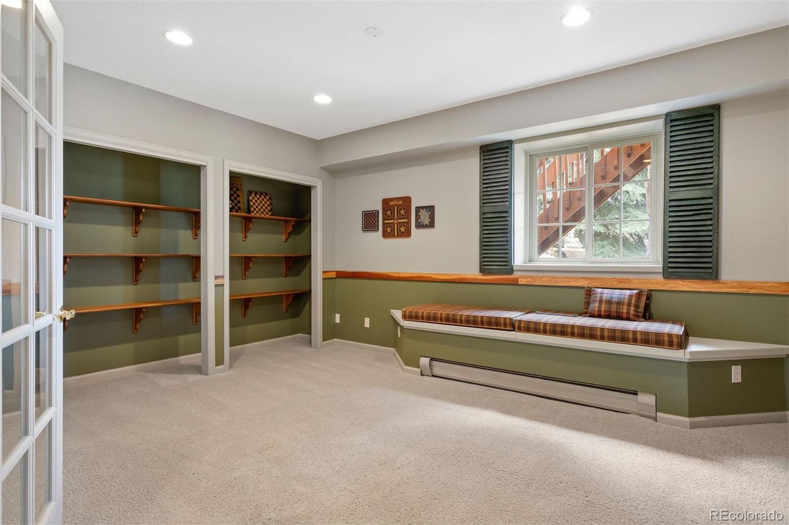 10 Roder Gate Lane Castle Pines, CO 80108 - Photo 19 of 32 a spacious bedroom with a bed and a window
