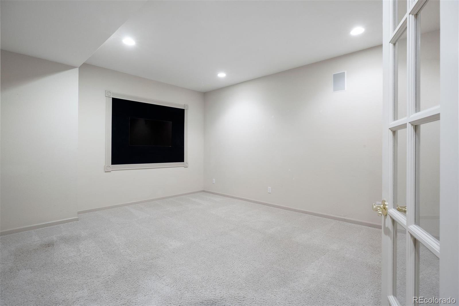 10 Roder Gate Lane Castle Pines, CO 80108 - Photo 21 of 32 an empty room with windows