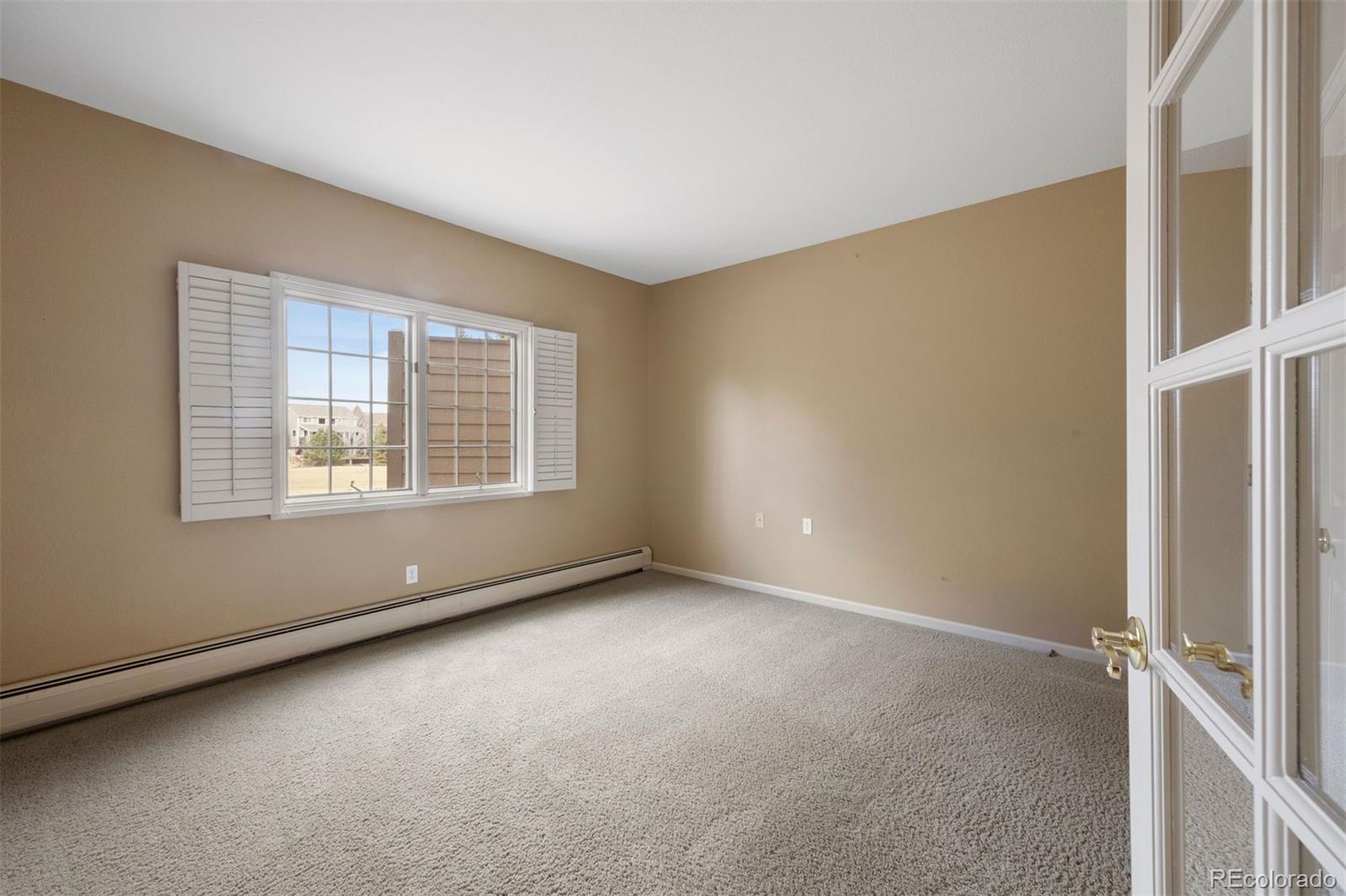 10 Roder Gate Lane Castle Pines, CO 80108 - Photo 23 of 32 a view of an empty room with a window