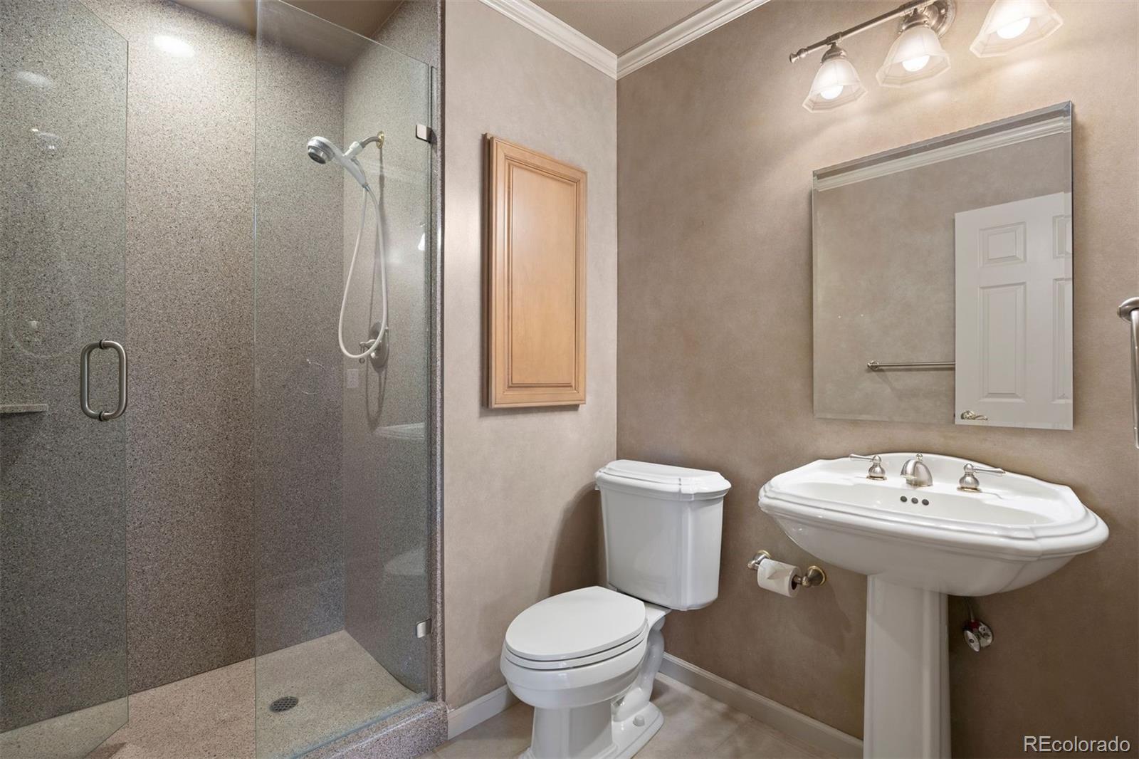 10 Roder Gate Lane Castle Pines, CO 80108 - Photo 24 of 32 a bathroom with a sink toilet and a mirror