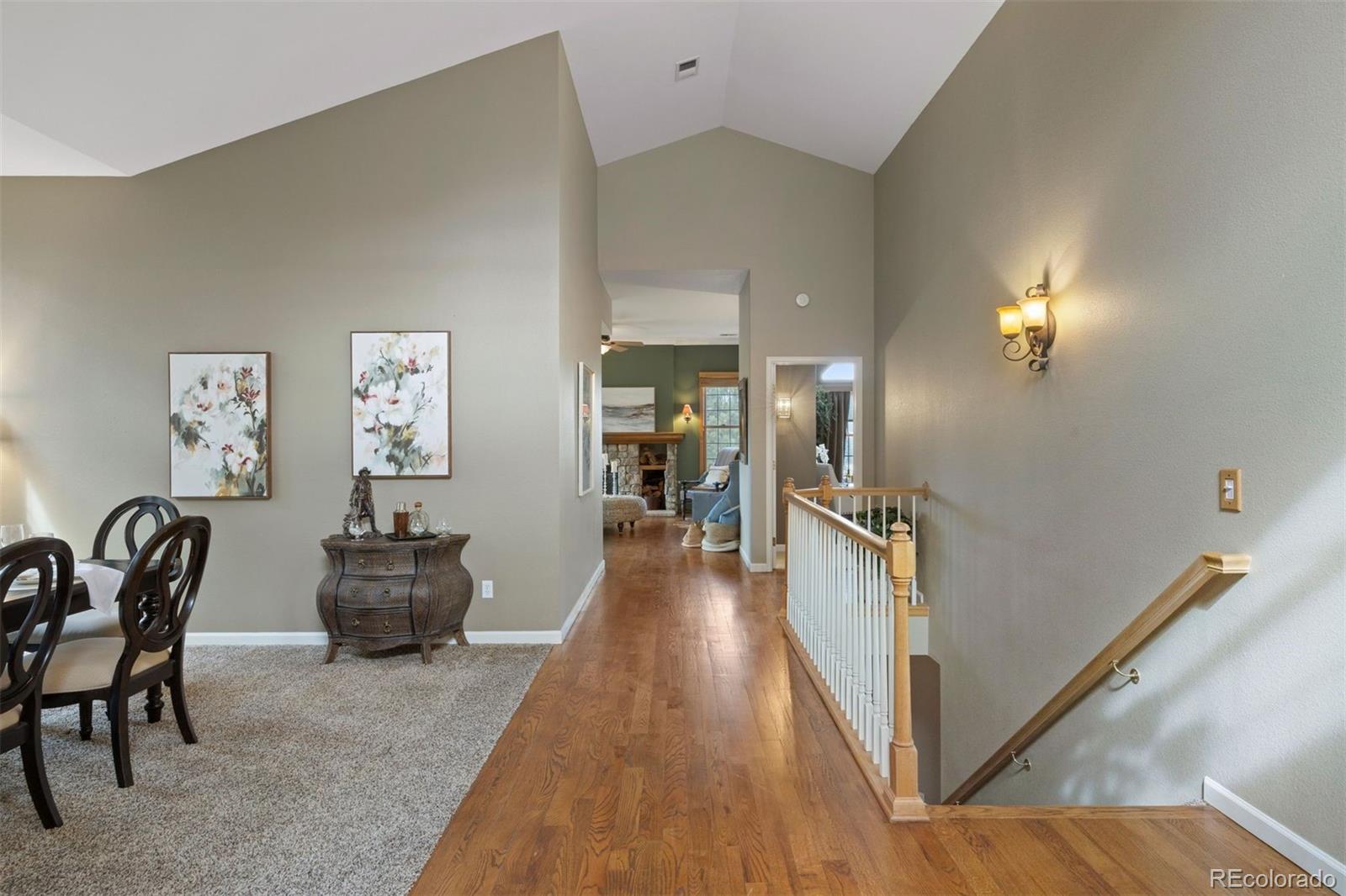 10 Roder Gate Lane Castle Pines, CO 80108 - Photo 9 of 32 a view of a hallway with furniture