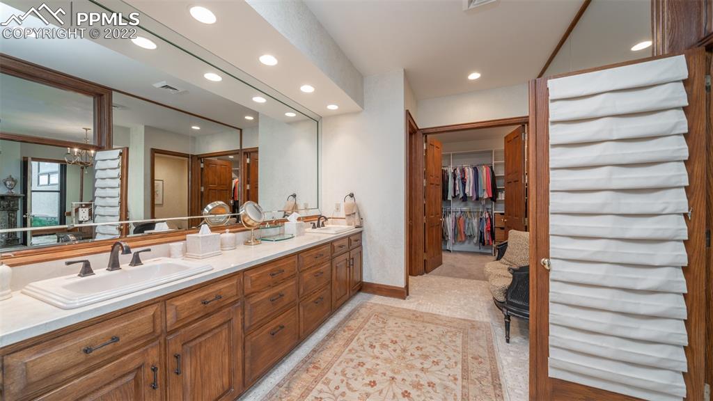 105 Marland Road Colorado Springs, CO 80906 - Photo 17 of 50 a bathroom with a sink and a mirror