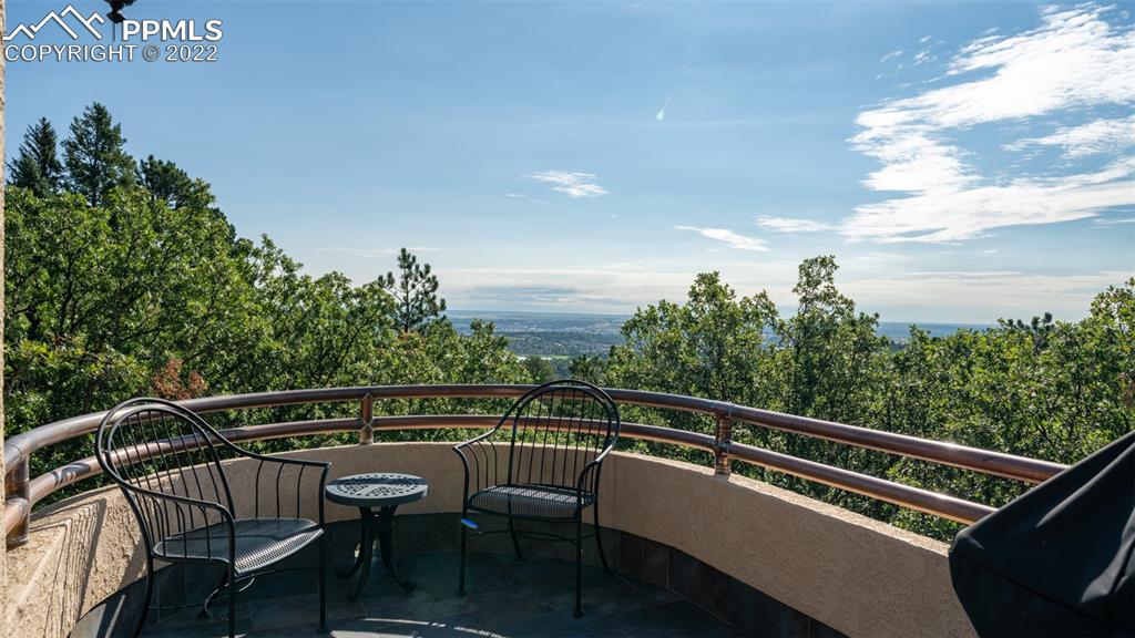 105 Marland Road Colorado Springs, CO 80906 - Photo 19 of 50 a view of a chair and tables on the balcony