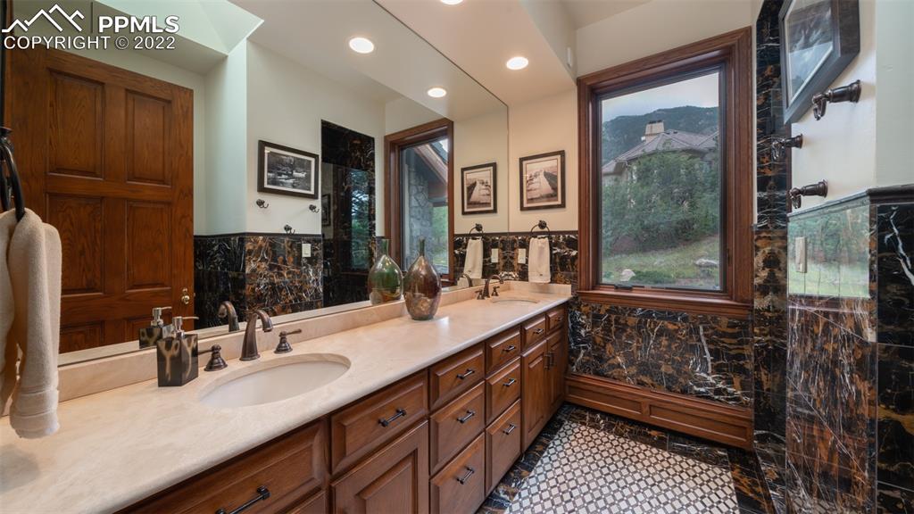 105 Marland Road Colorado Springs, CO 80906 - Photo 22 of 50 a bathroom with a sink and a mirror