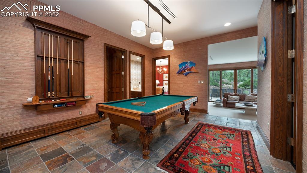 105 Marland Road Colorado Springs, CO 80906 - Photo 36 of 50 a room with pool table and windows