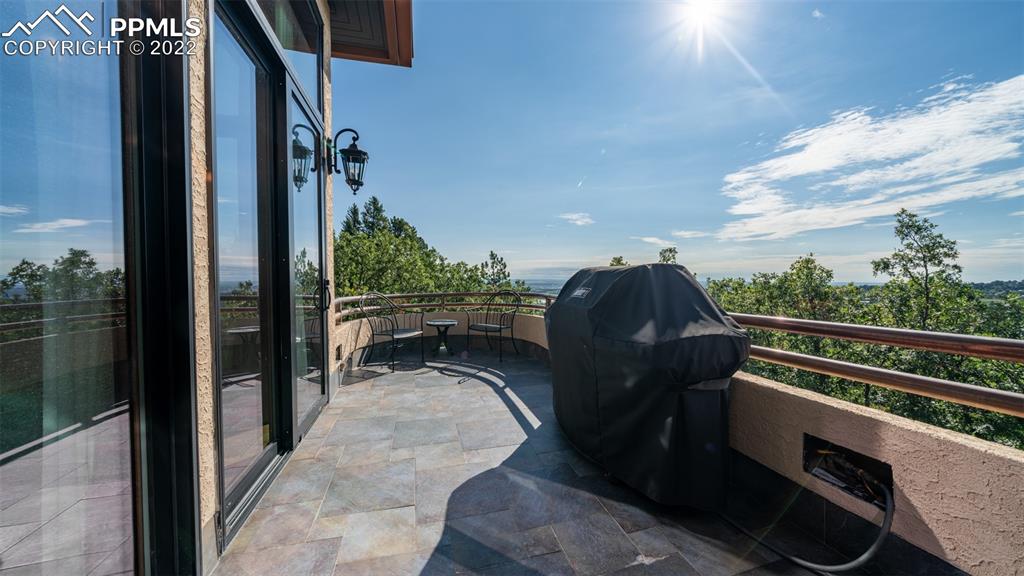 105 Marland Road Colorado Springs, CO 80906 - Photo 40 of 50 a view of a balcony with furniture and city view