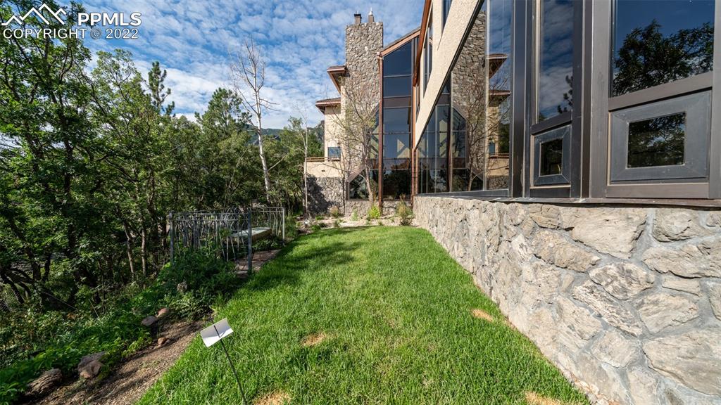 105 Marland Road Colorado Springs, CO 80906 - Photo 43 of 50 a view of a house with a yard