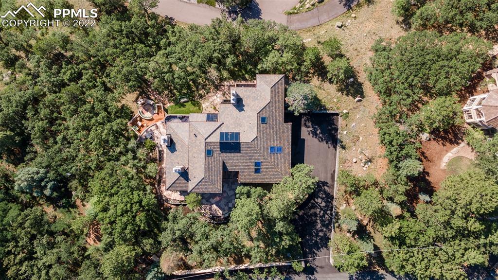 105 Marland Road Colorado Springs, CO 80906 - Photo 48 of 50 an aerial view of a house with a yard and garden