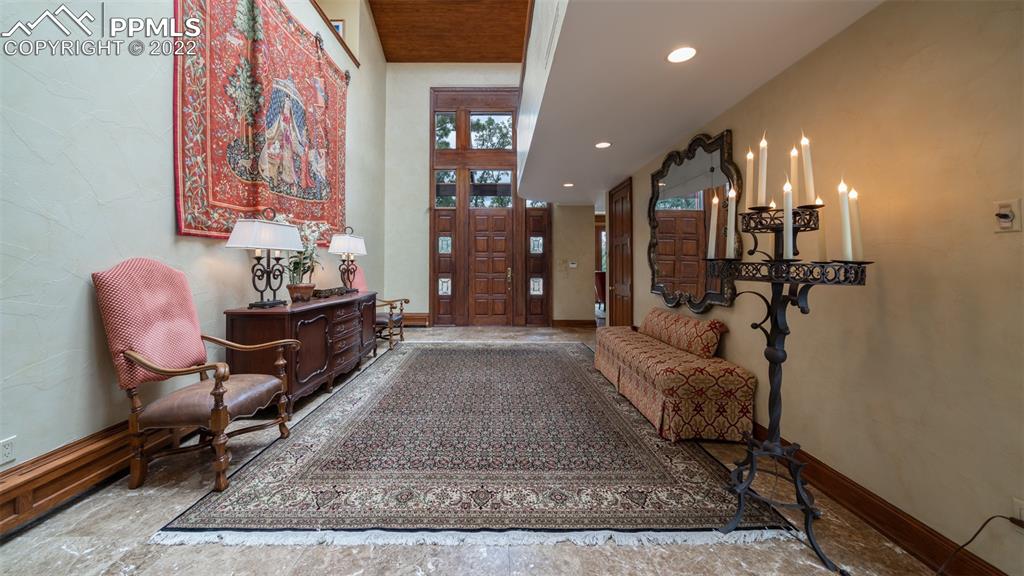 105 Marland Road Colorado Springs, CO 80906 - Photo 5 of 50 a living room with furniture and a rug