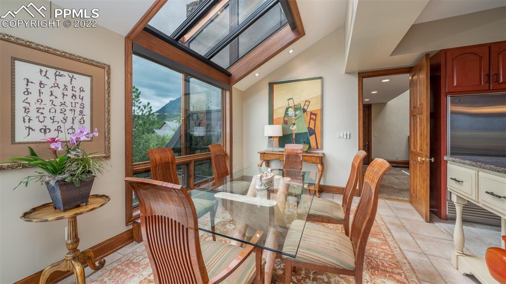 105 Marland Road Colorado Springs, CO 80906 - Photo 9 of 50 a view of a dining room with furniture window and wooden floor