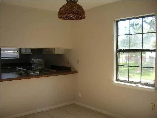 a bathroom with a sink and a window