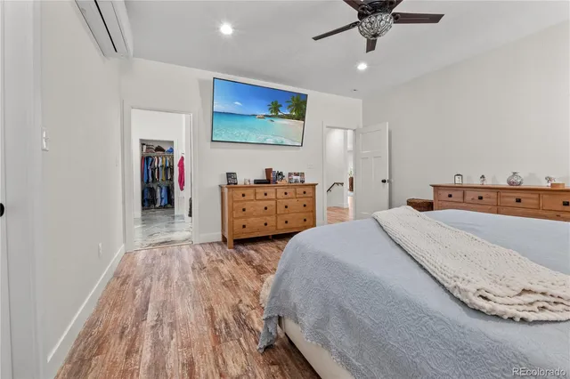 a bedroom with bed and window