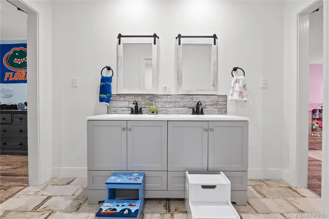 a bathroom with a sink and a mirror