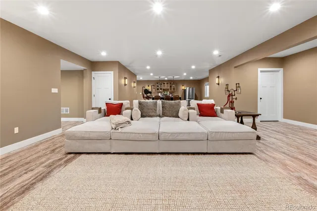 a bedroom with a large bed and a couch