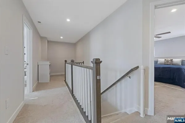 a view of a hallway with a bathroom