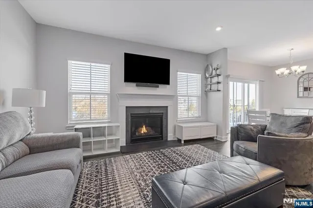 a living room with furniture fireplace and window