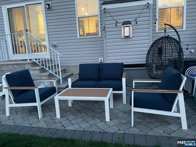 an aerial view of multiple houses with a yard