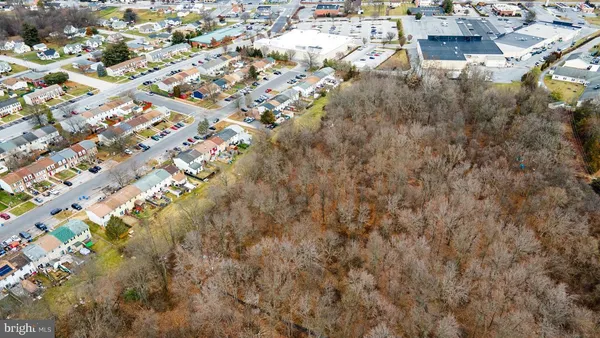 an aerial view of residential building with green space