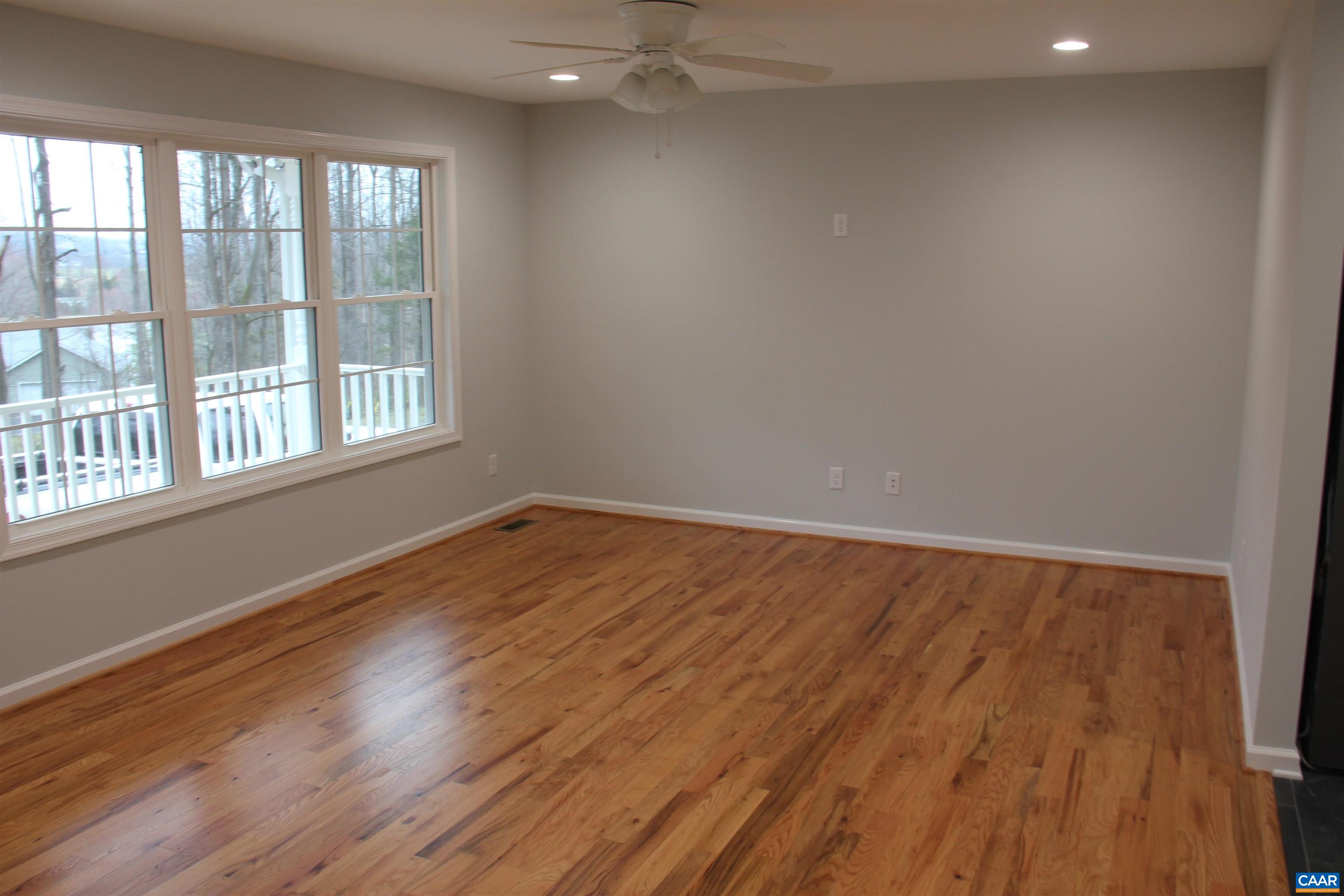 672 Westwood Road Stanardsville, VA 22973 - Photo 19 of 31 wooden floor in an empty room with a window