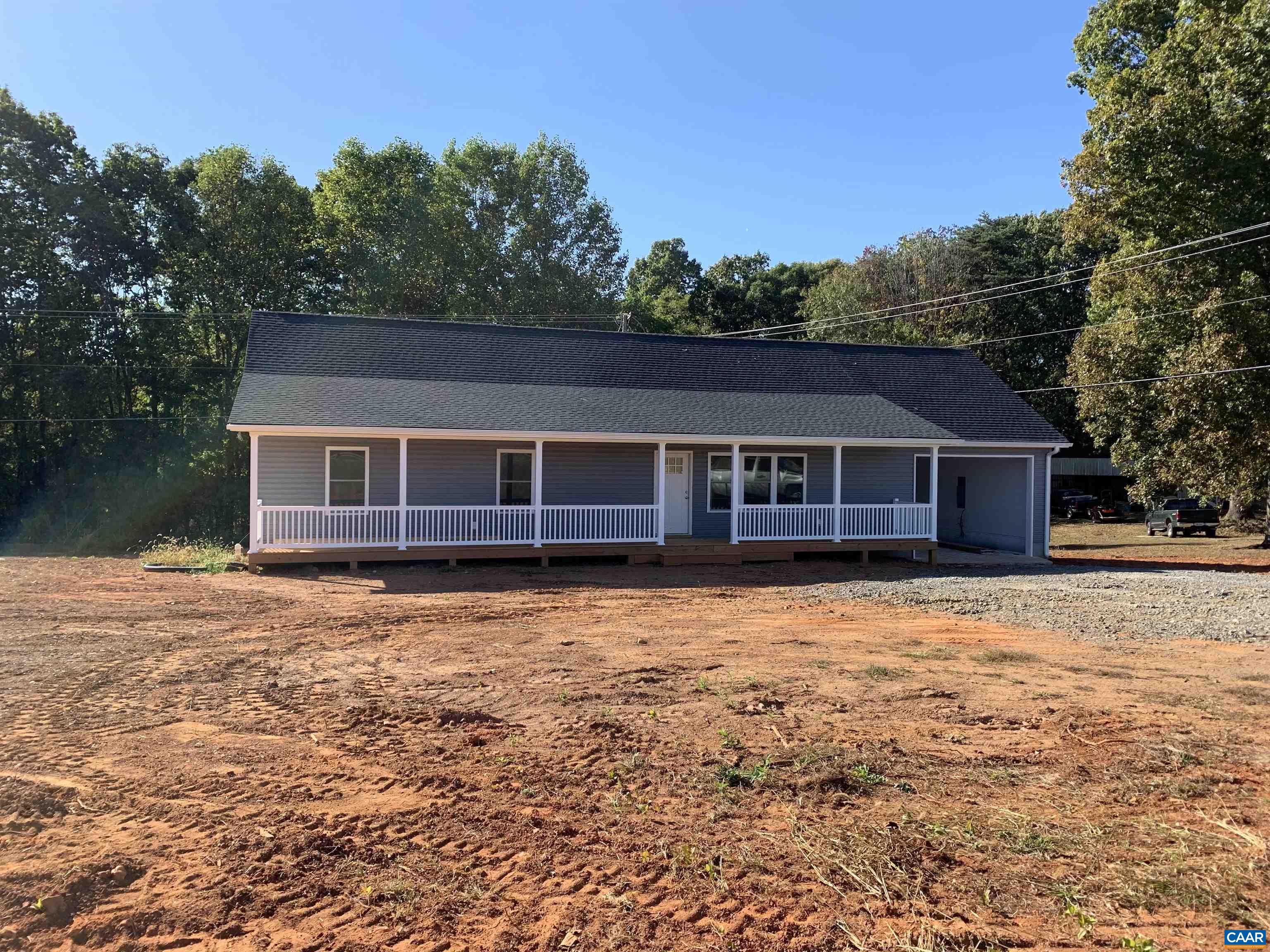 672 Westwood Road Stanardsville, VA 22973 - Photo 2 of 31 a front view of a house with a garden
