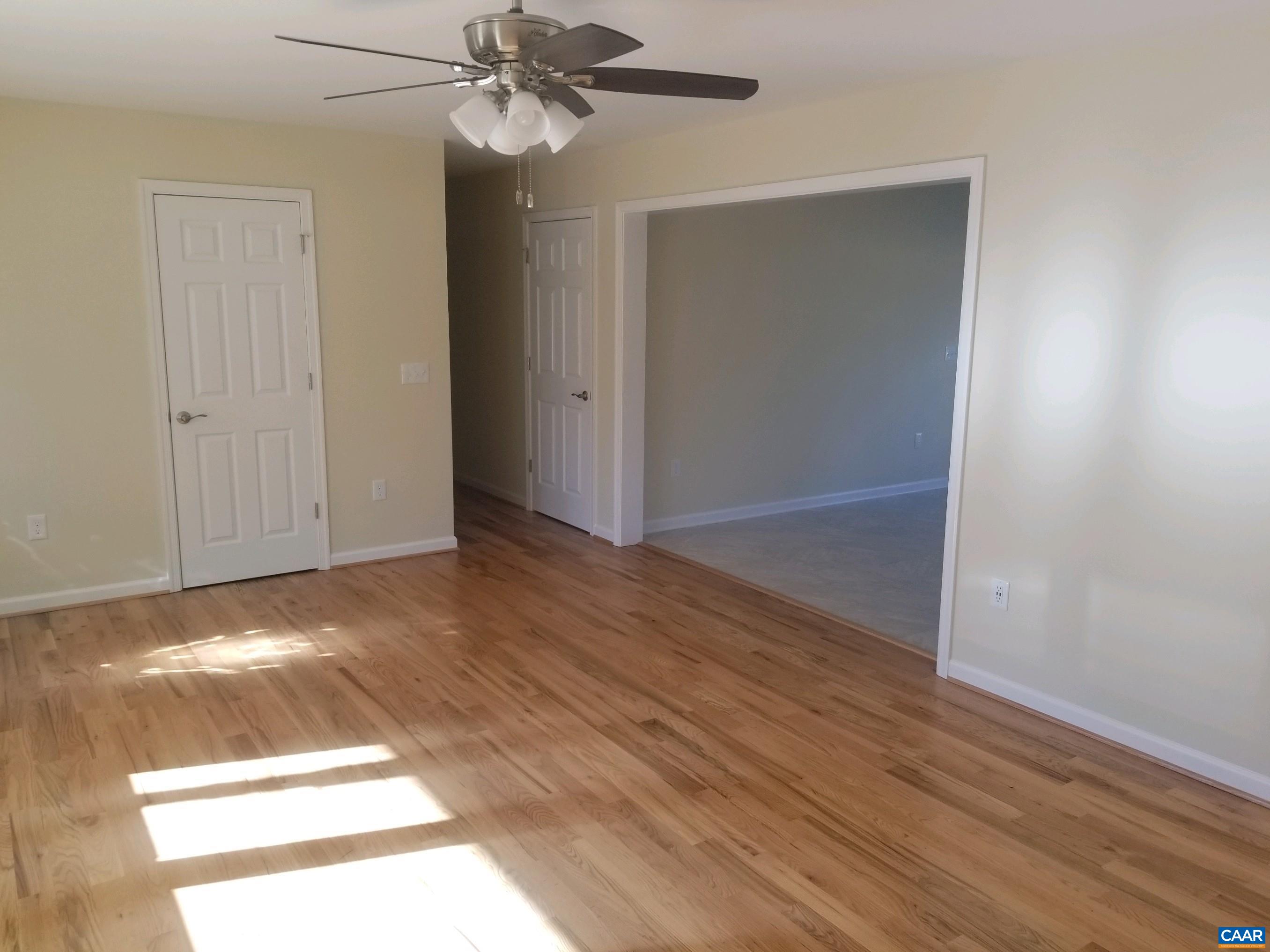 672 Westwood Road Stanardsville, VA 22973 - Photo 24 of 31 an empty room with wooden floor closet and windows