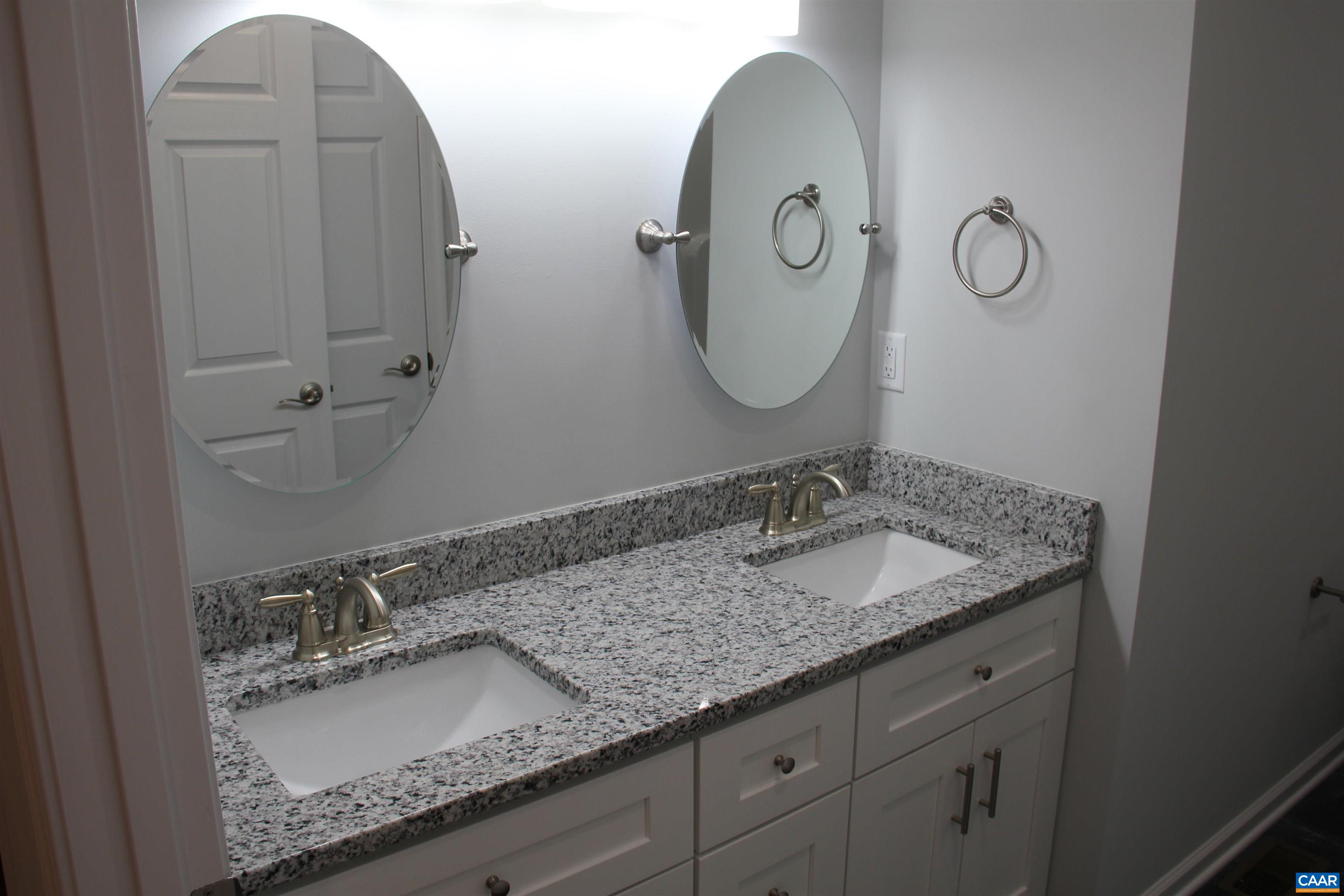 672 Westwood Road Stanardsville, VA 22973 - Photo 27 of 31 a bathroom with a granite countertop sink and a mirror