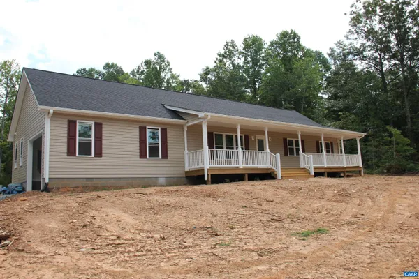 a front view of a house with yard