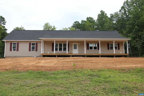 front view of a house with a garden