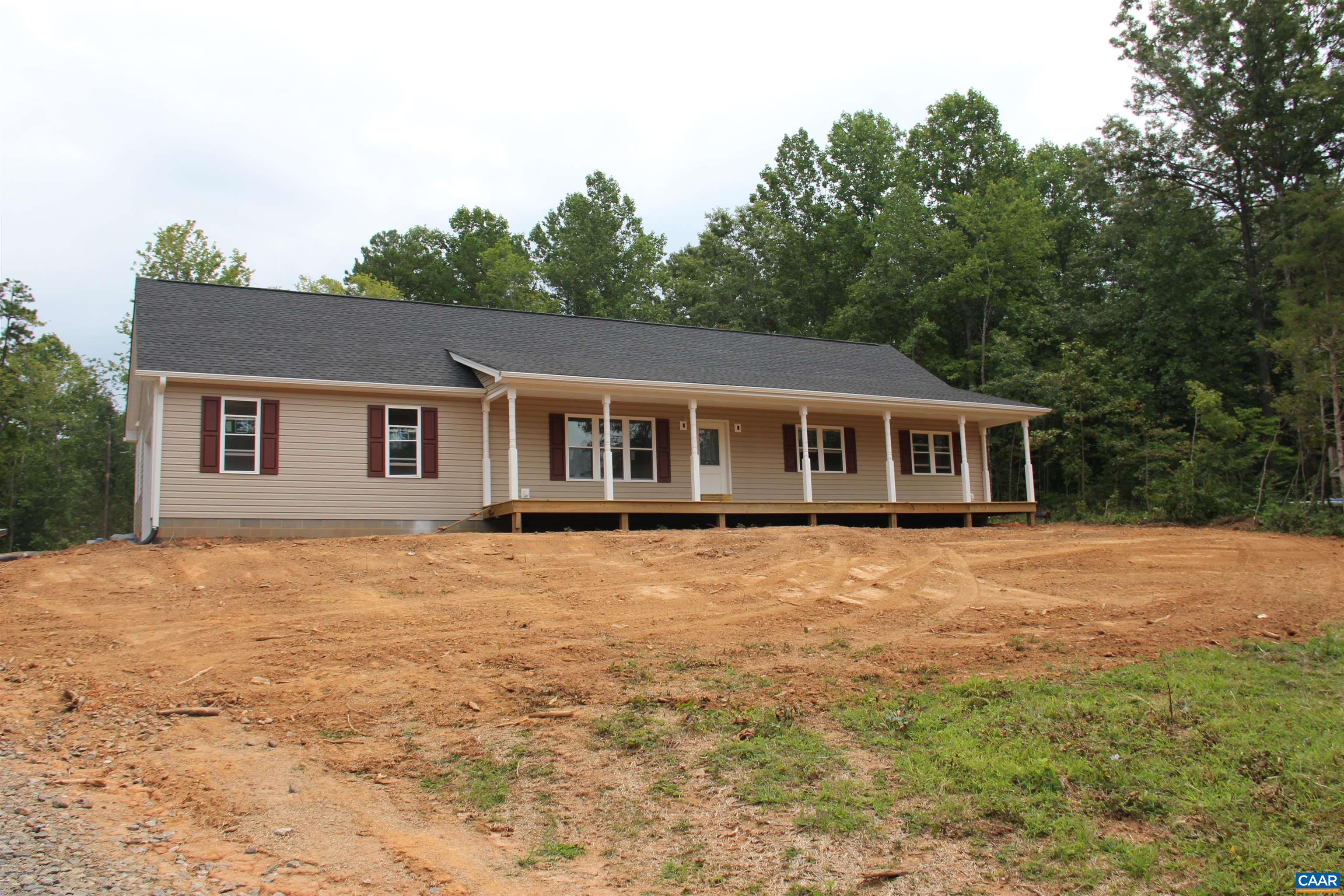 672 Westwood Road Stanardsville, VA 22973 - Photo 6 of 31 a house with trees in the background