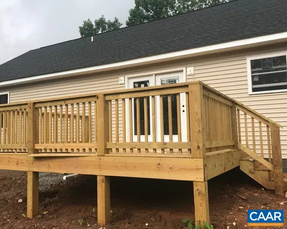 a view of balcony with table and chairs