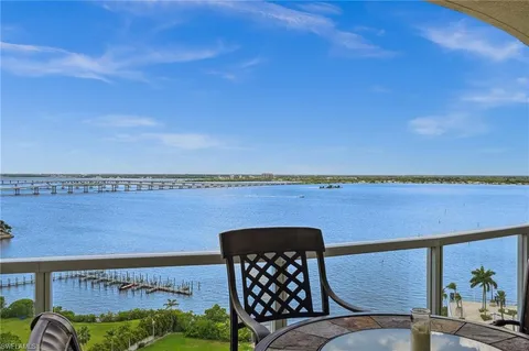 a view of a balcony with table and chairs