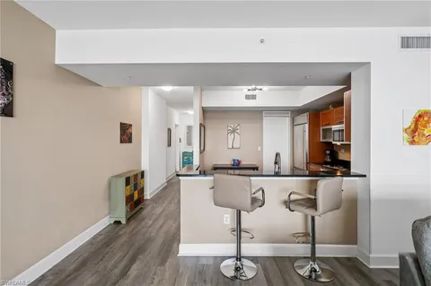 a kitchen with stainless steel appliances granite countertop a sink and cabinets