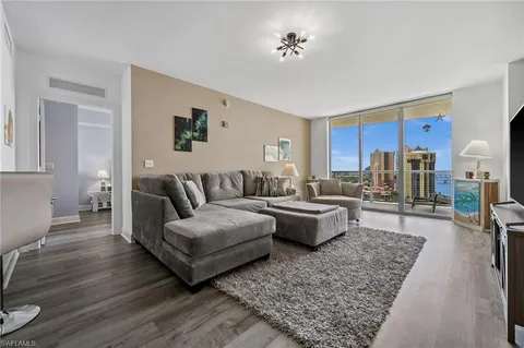 a living room with furniture and a rug