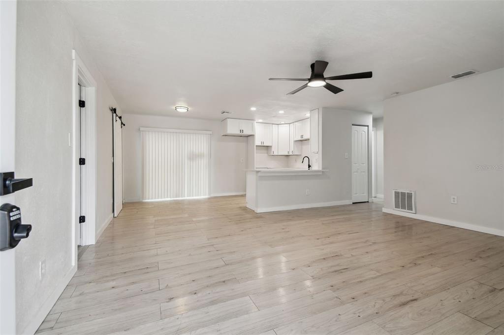 3414 Lindsey Street Dover, FL 33527 - Photo 11 of 45 a view of a kitchen with a sink and a refrigerator