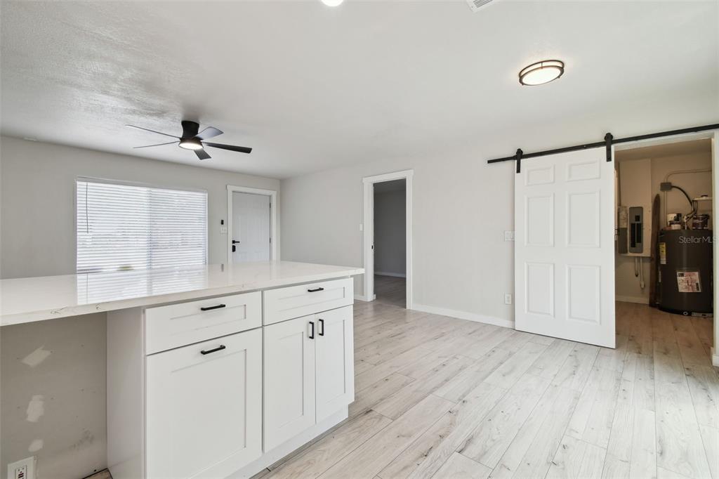 3414 Lindsey Street Dover, FL 33527 - Photo 16 of 45 a view of cabinets and wooden floor