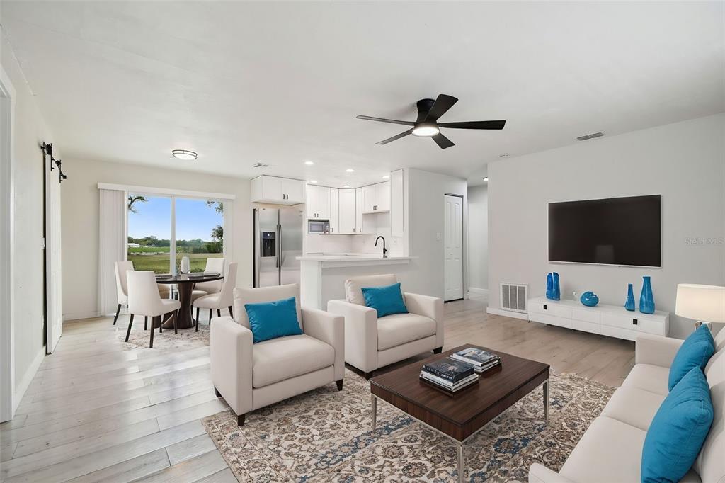 3414 Lindsey Street Dover, FL 33527 - Photo 2 of 45 a living room with furniture and a flat screen tv
