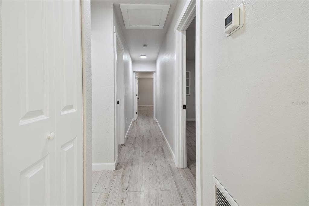 3414 Lindsey Street Dover, FL 33527 - Photo 21 of 45 a view of a hallway with wooden floor