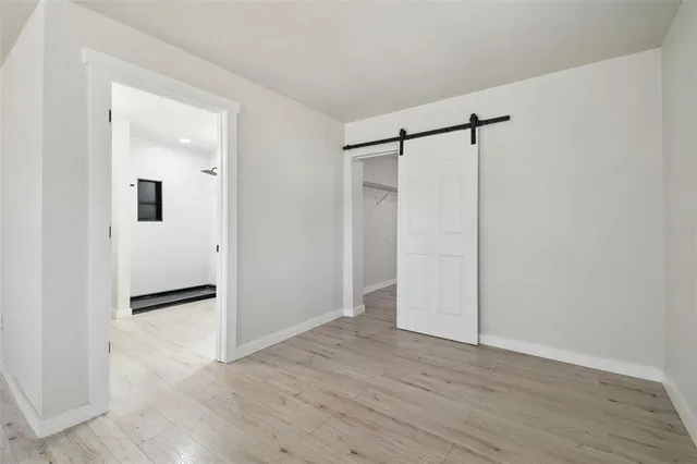 a bathroom with a double vanity sink a mirror and shower