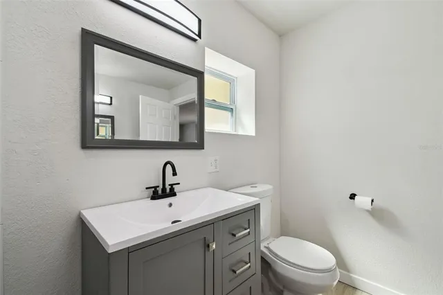 a bathroom with a shower and a sink