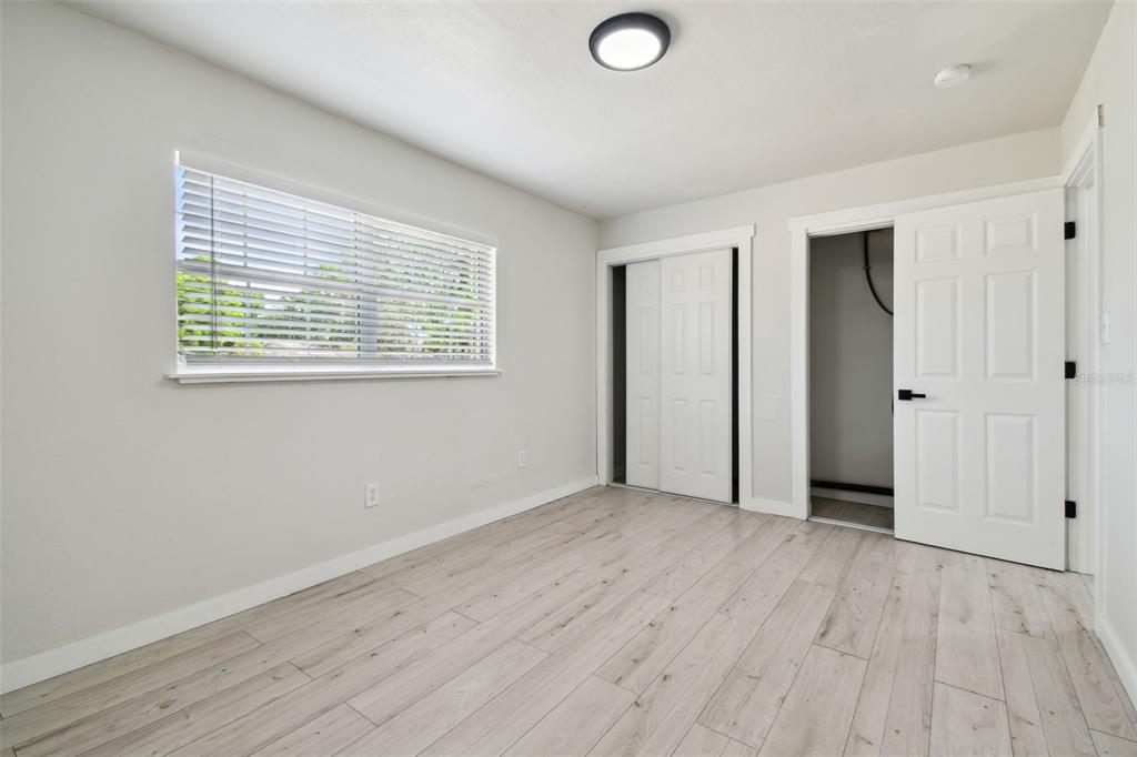 3414 Lindsey Street Dover, FL 33527 - Photo 33 of 45 an empty room with wooden floor and windows