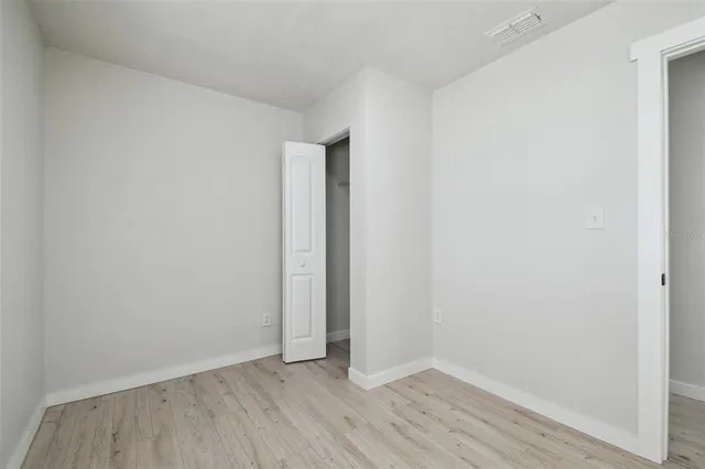 a bathroom with a toilet a sink a mirror and a bathtub